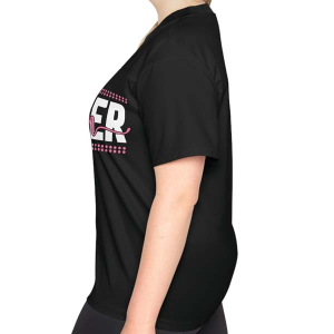 Side profile of a woman wearing the black t-shirt. Part of the white and pink "ER" section of the "SOCCER mom" graphic is visible on the chest.